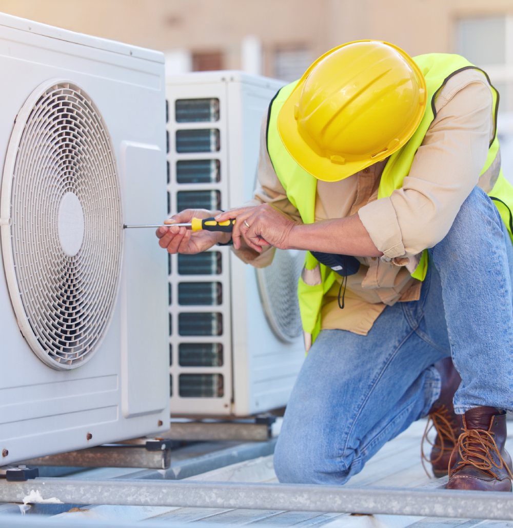Worker fixing air conditioning system