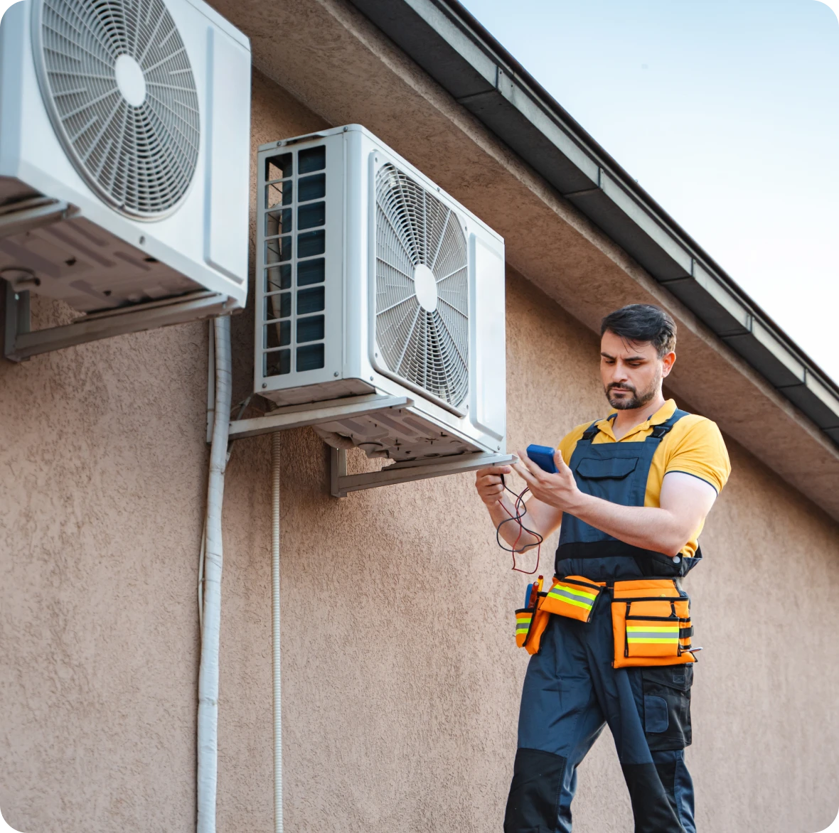HVAC professional with tools inspecting AC