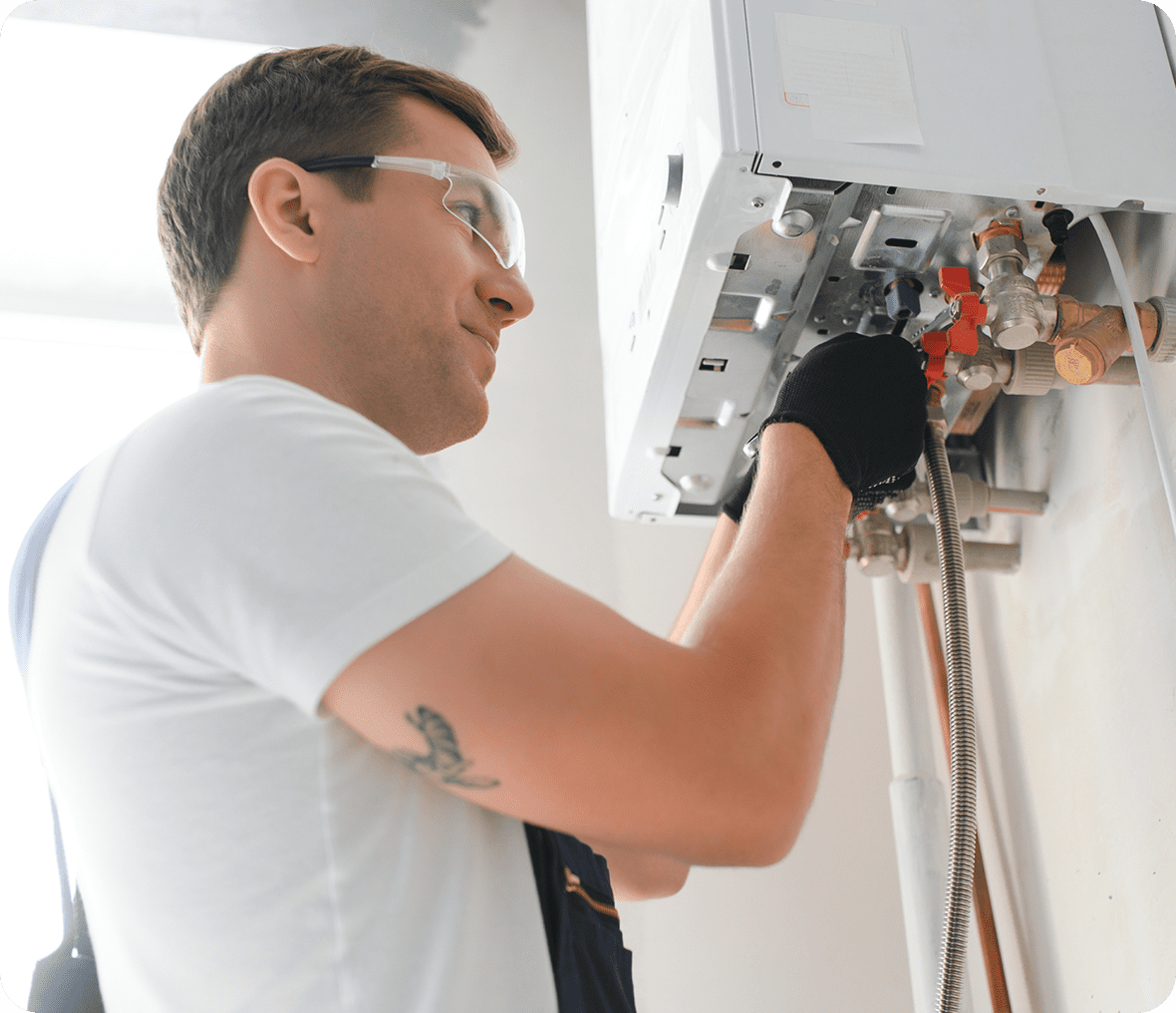 Man servicing a gas boiler