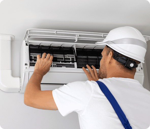Technician repairing air conditioning unit
