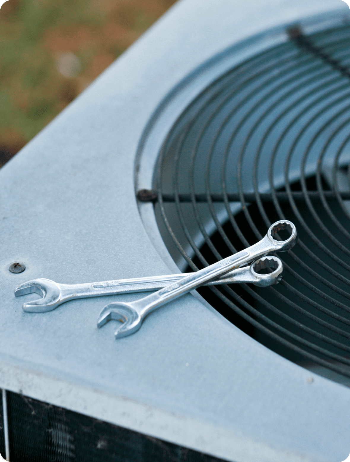 Wrenches on air conditioning unit